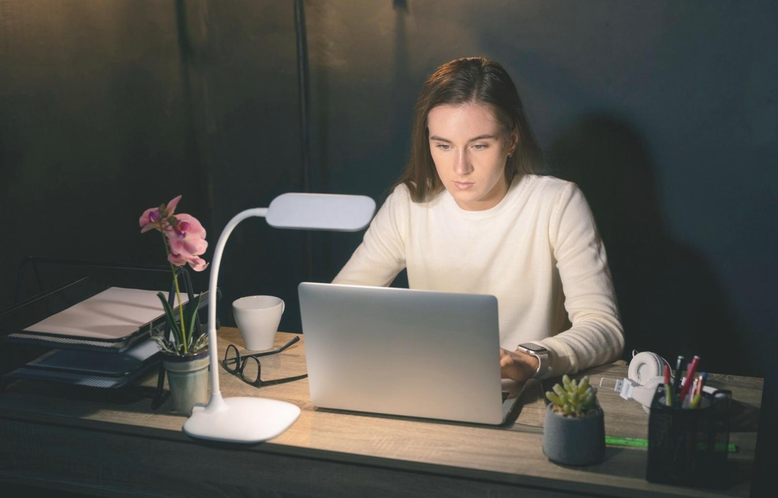 Professional reviewing financial technology analytics on multiple displays