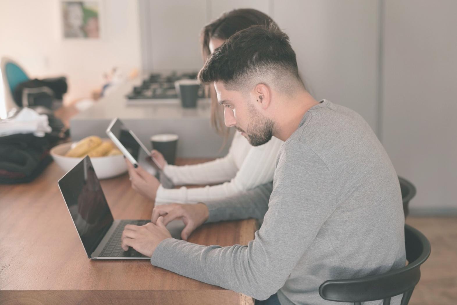 Students working with financial technology platforms during practical training session